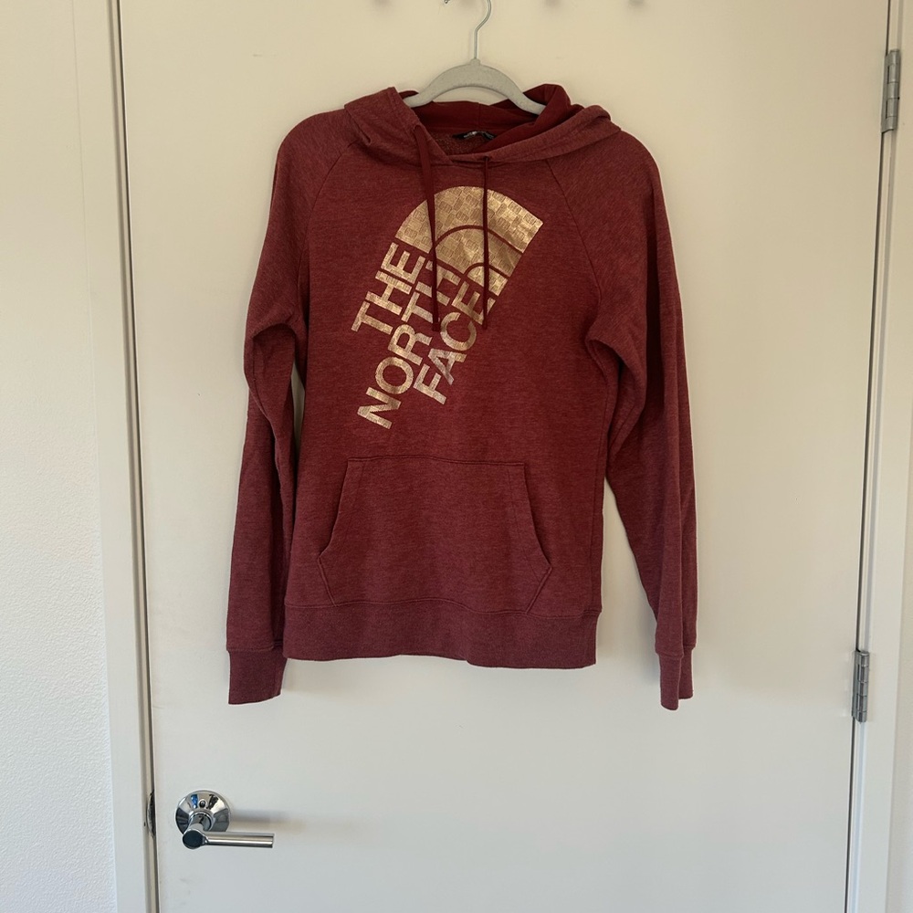 The North Face Burgundy Hoodie with Gold Logo